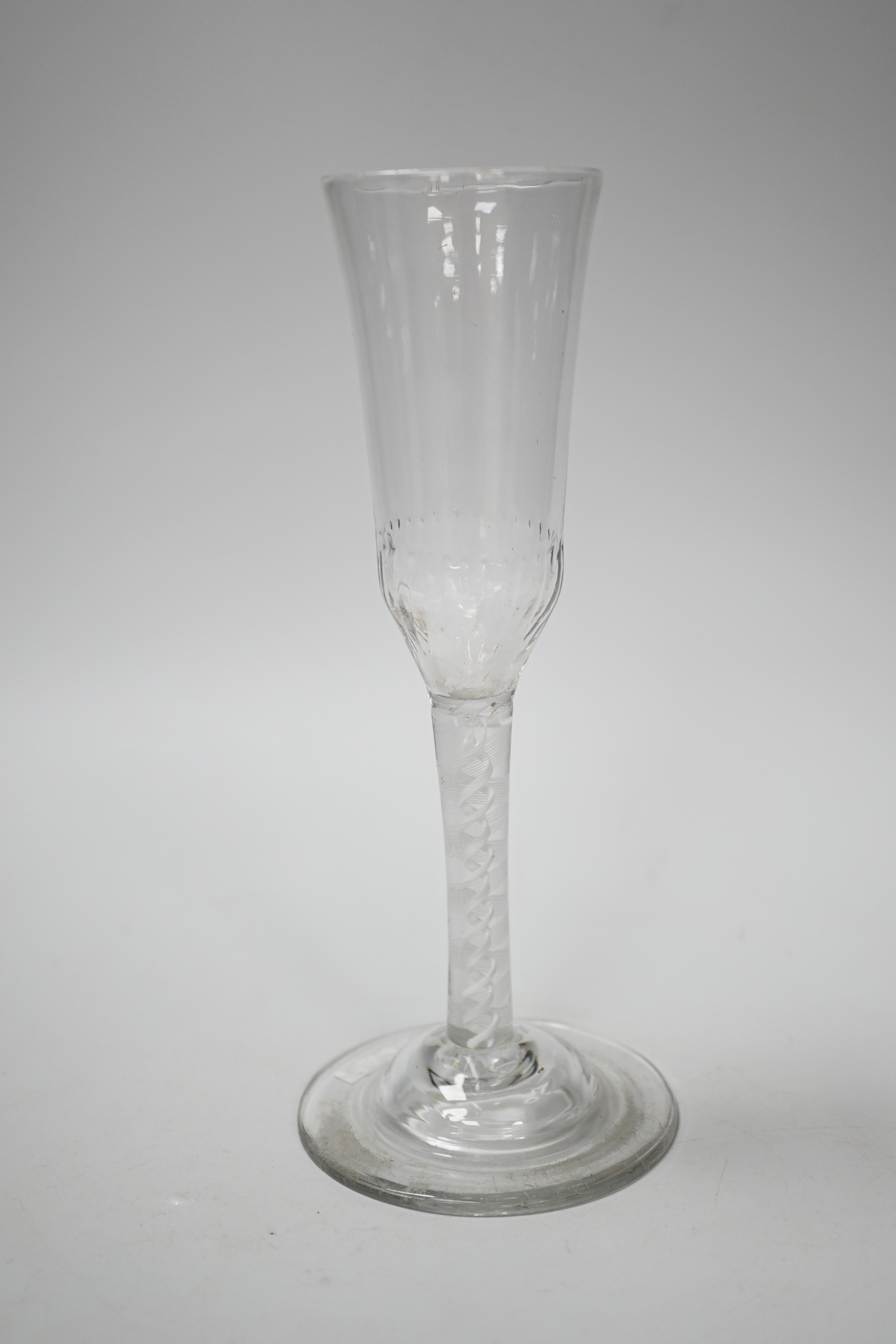 An English lead crystal ratafia glass, c.1750-60, the bowl is slightly waisted and elongated with an ogee finish and basal moulding, DSOT two spiral tapes inside rare eleven ply thread, domed foot, tool marked bowl and r